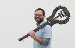Photo by Peter Macdiarmid pedro reyes with instrument like sculpture made from guns